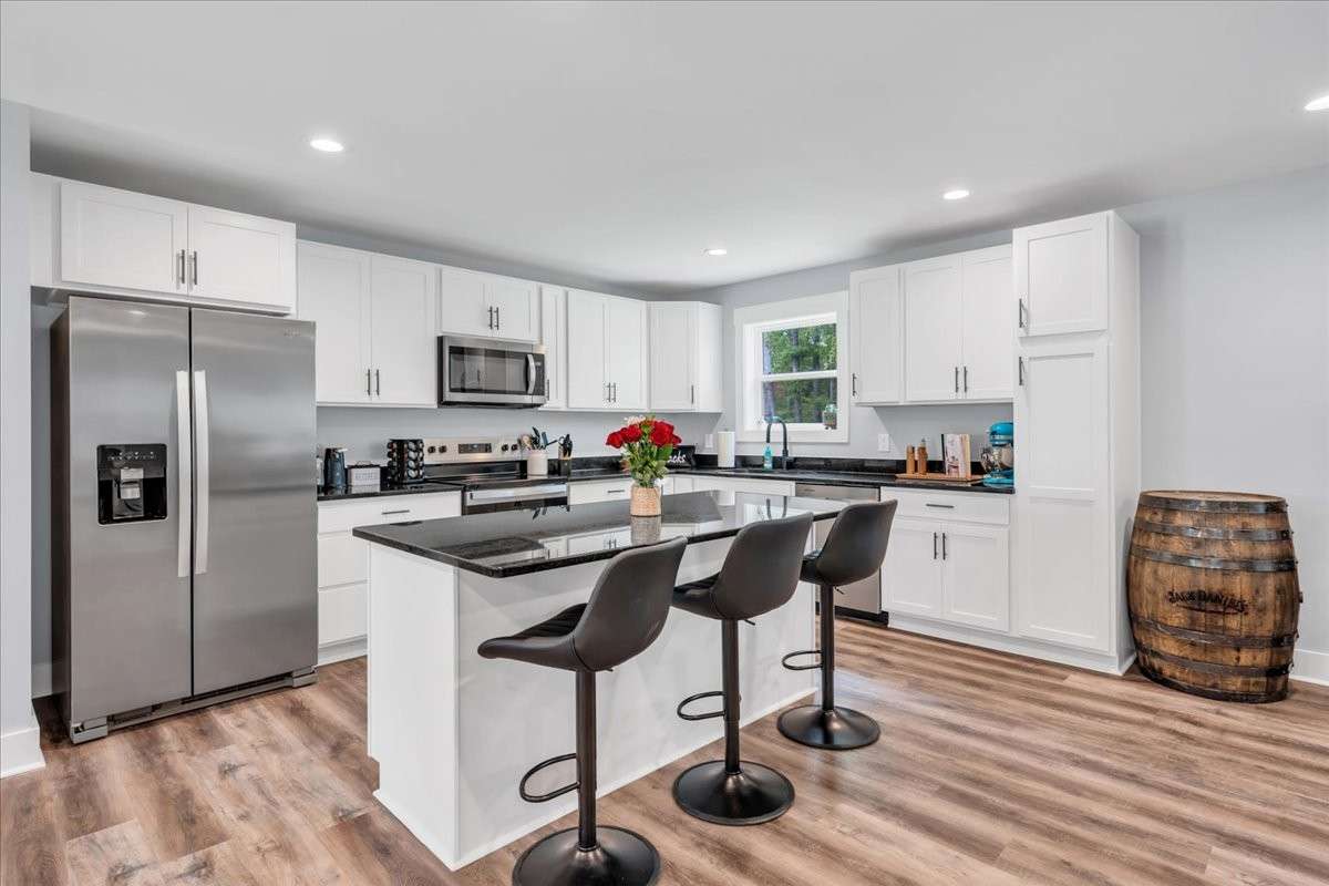 The beautiful granite countertops offer ample workspace while adding a touch of sophistication.