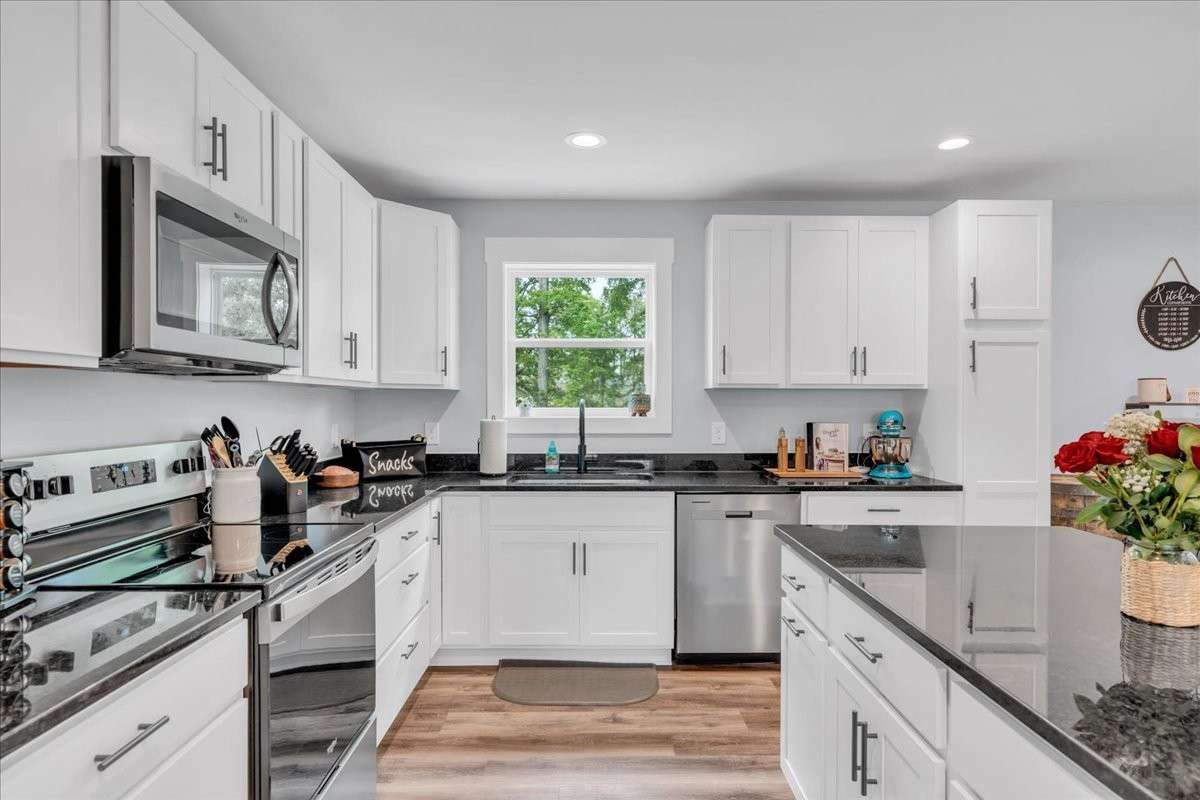 Welcome to the heart of the home-an exquisite kitchen designed with an open floor plan that invites warmth and togetherness.