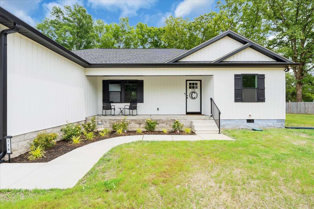 The beautifully landscaped yard enhances curb appeal and invites you inside.