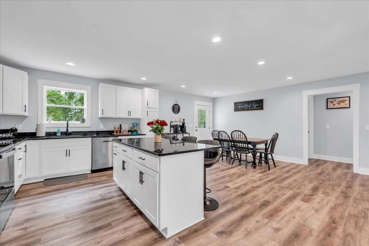 This culinary haven features a stunning island with bar seating, perfect for casual dining or entertaining guests.