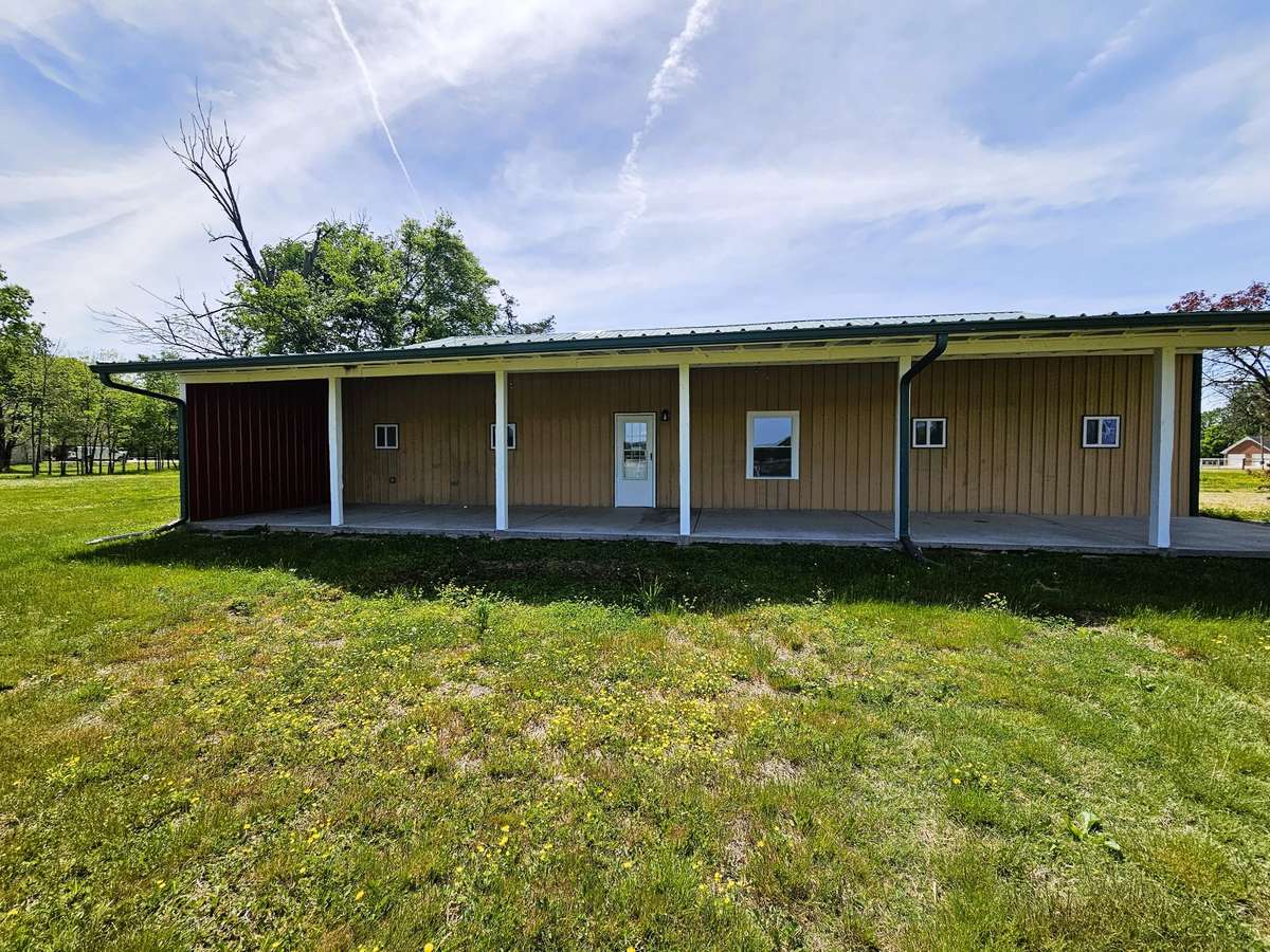 Look at that AMAZING covered porch!  It also got a new metal roof and is a great place to grab some shade. Maybe you kick back in some rocking chairs and enjoy some home made ice cream. How nice does that sound?