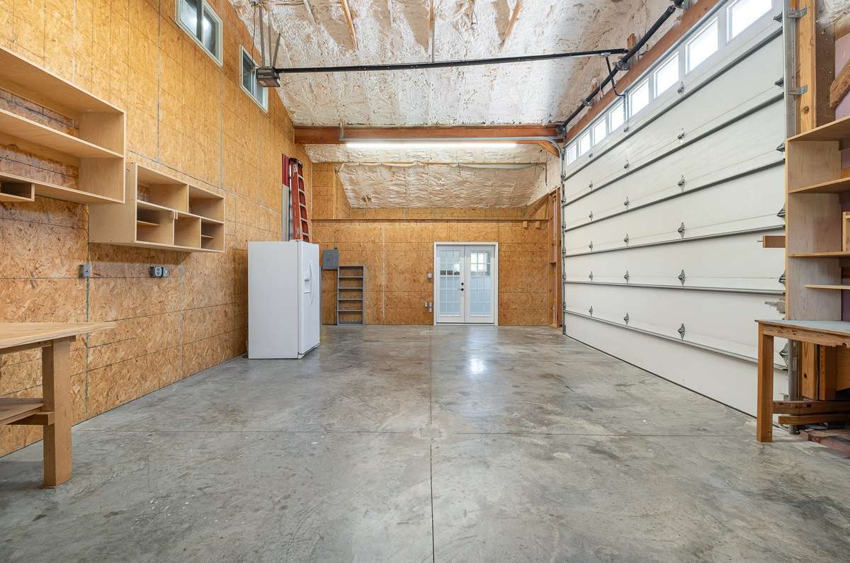 At just over 19' x 31', the attached garage / workshop offers plenty of space for parking vehicles, storage, or perhaps use as a hobby area.  The garage door is 12' tall and will easily accommodate most vehicles.