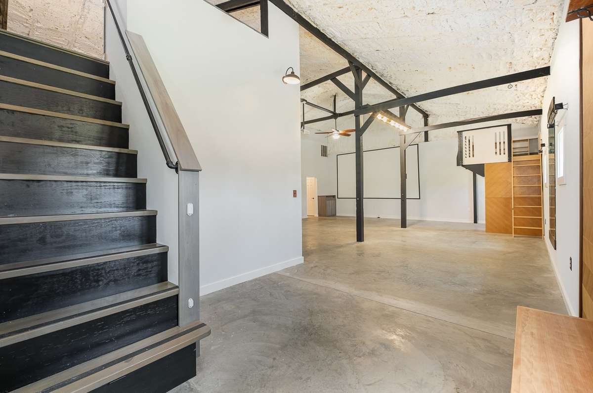 Another view from the entry foyer / hall as we enter the home. The interior was professionally painted less than a year ago. The exposed beams / trellis work add to the custom feel of this one.