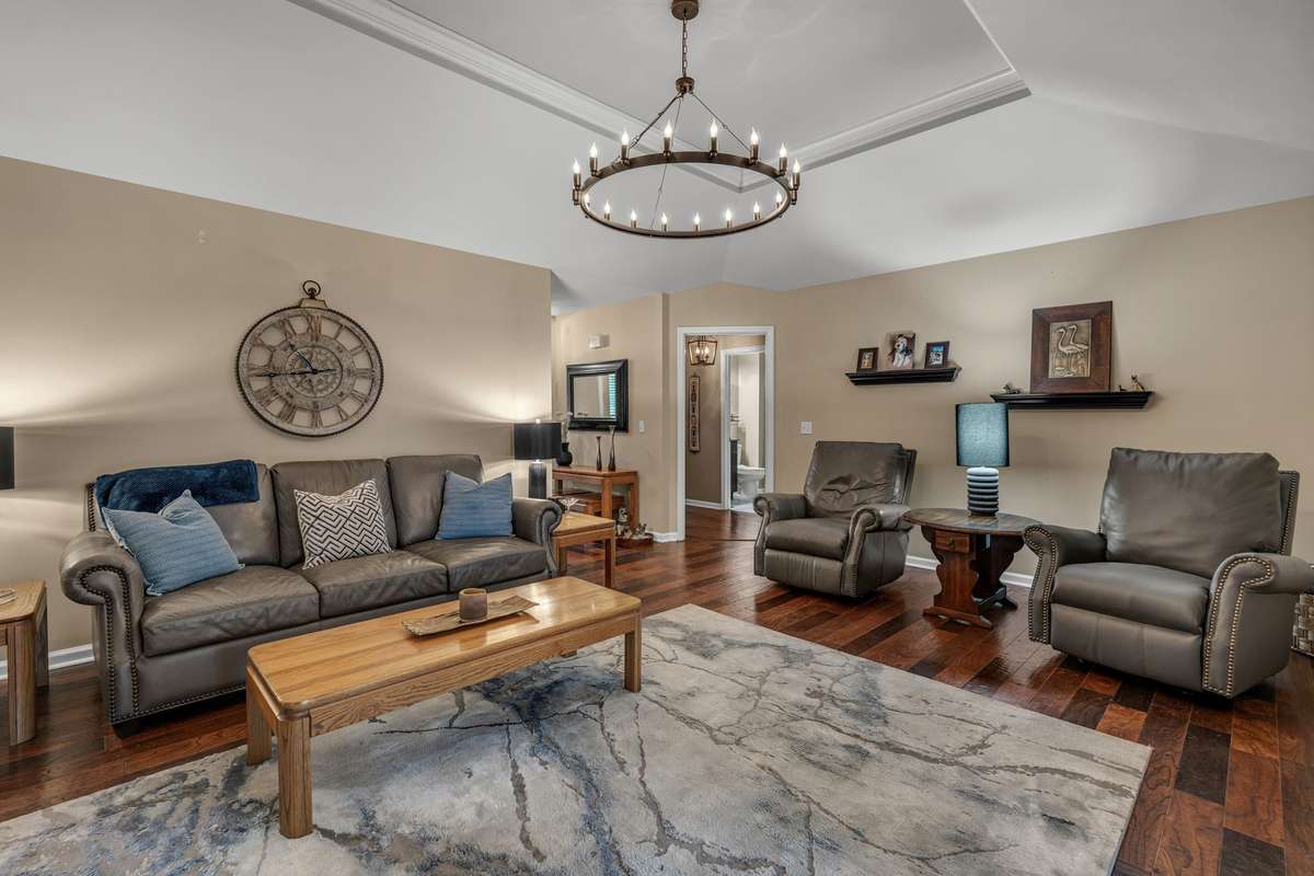 Tray ceiling in the Living Room overlooks private backyard