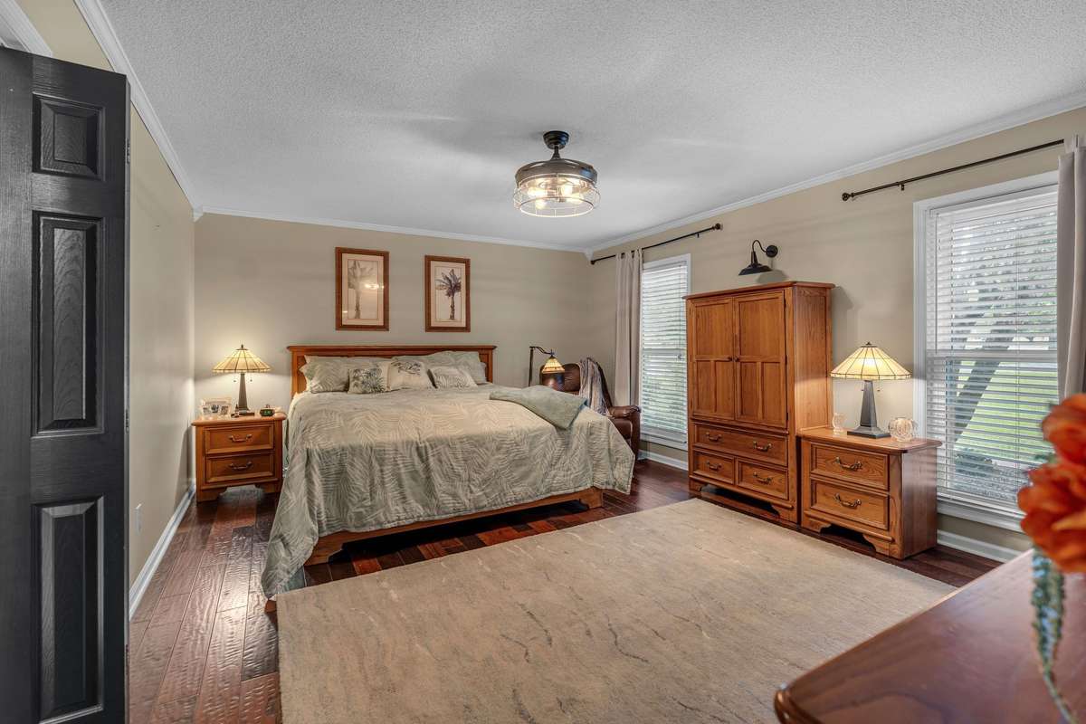 Large Primary Suite overlooking front yard with en-suite