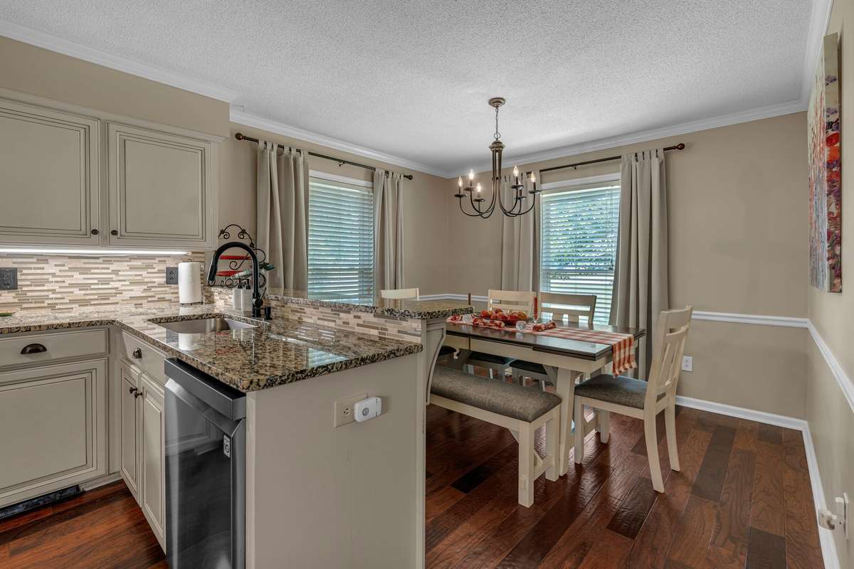 Eat-in dining in the kitchen with floor to ceiling windows for an abundance of natural light