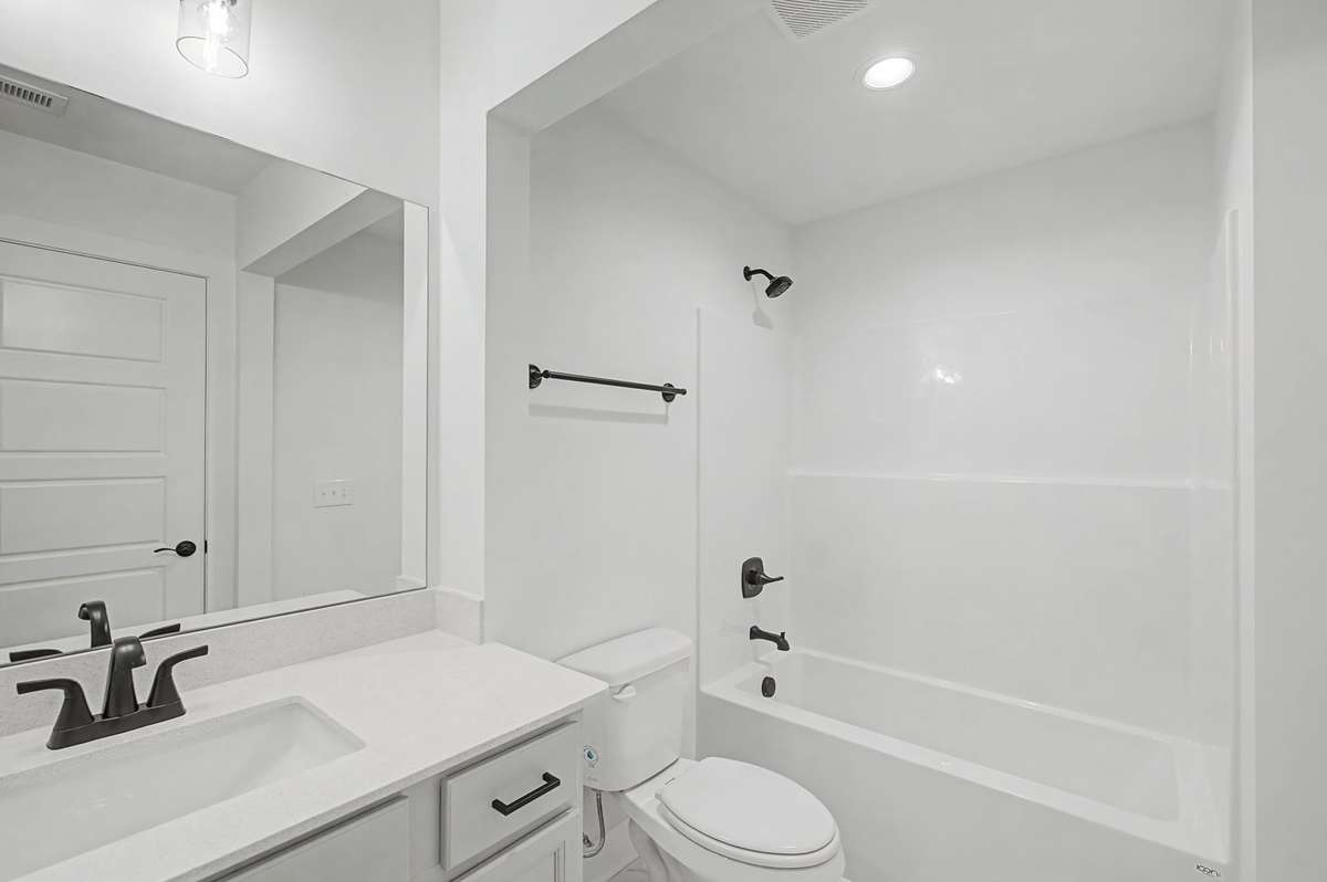 Photos of same floor plan but of another finished home in Oak Meadows by Surrey Homes. Photos are for illustration purposes only. Colors and materials may vary.