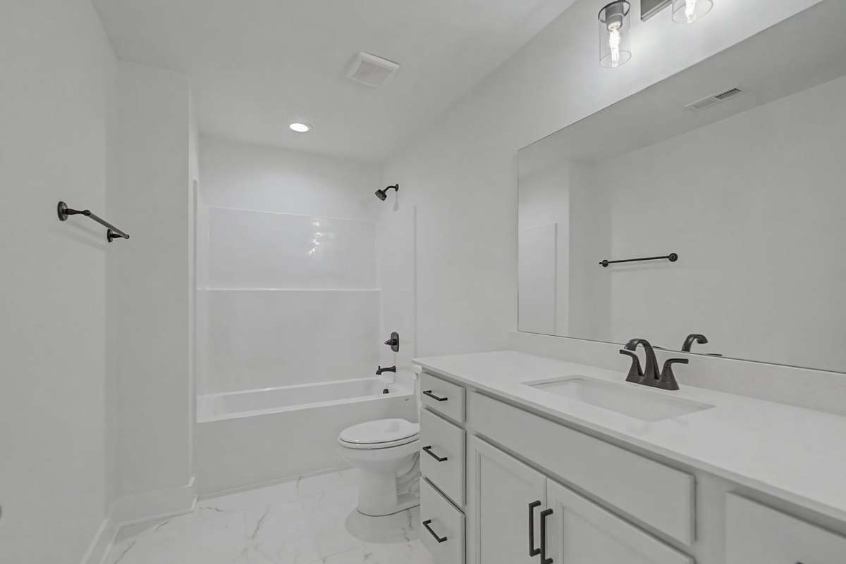Photos of same floor plan but of another finished home in Oak Meadows by Surrey Homes. Photos are for illustration purposes only. Colors and materials may vary.
