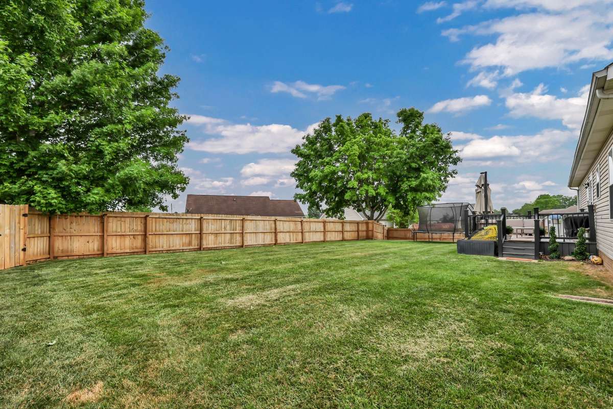 Flat, fenced, and ready for anything—this backyard delivers