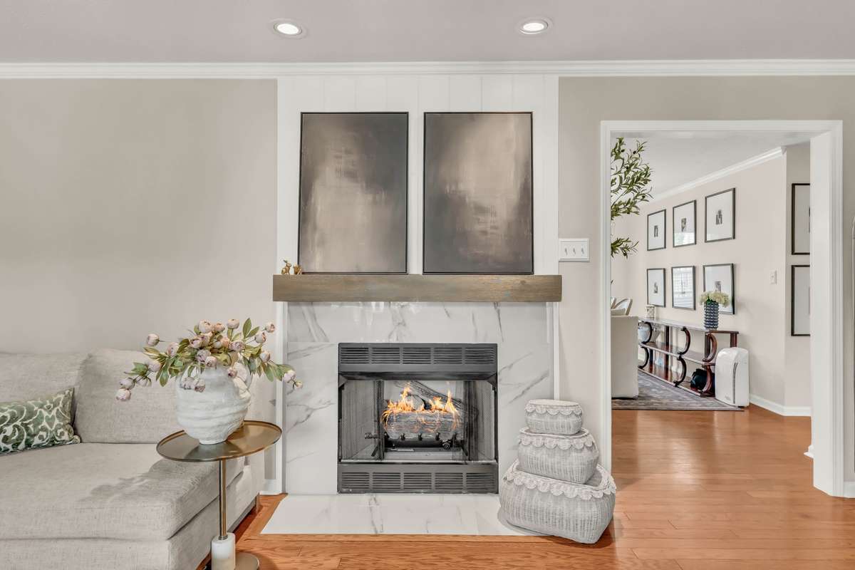 Gas fireplace featuring tile surround + shiplap