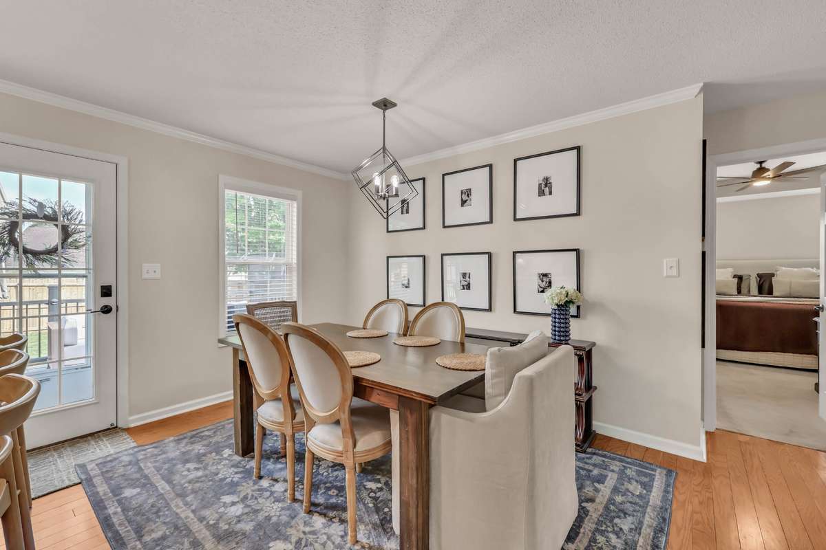 Dining area with natural light + modern lighting + direct patio access