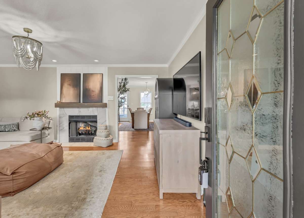 Step inside to designer finishes + beautiful hardwood floors.