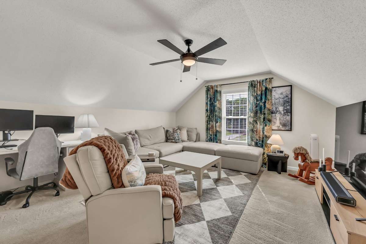The oversized bonus room with updated lighting/fan