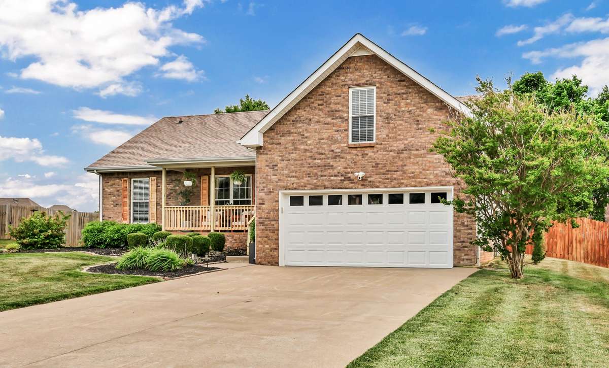 Charming brick exterior with covered front porch.