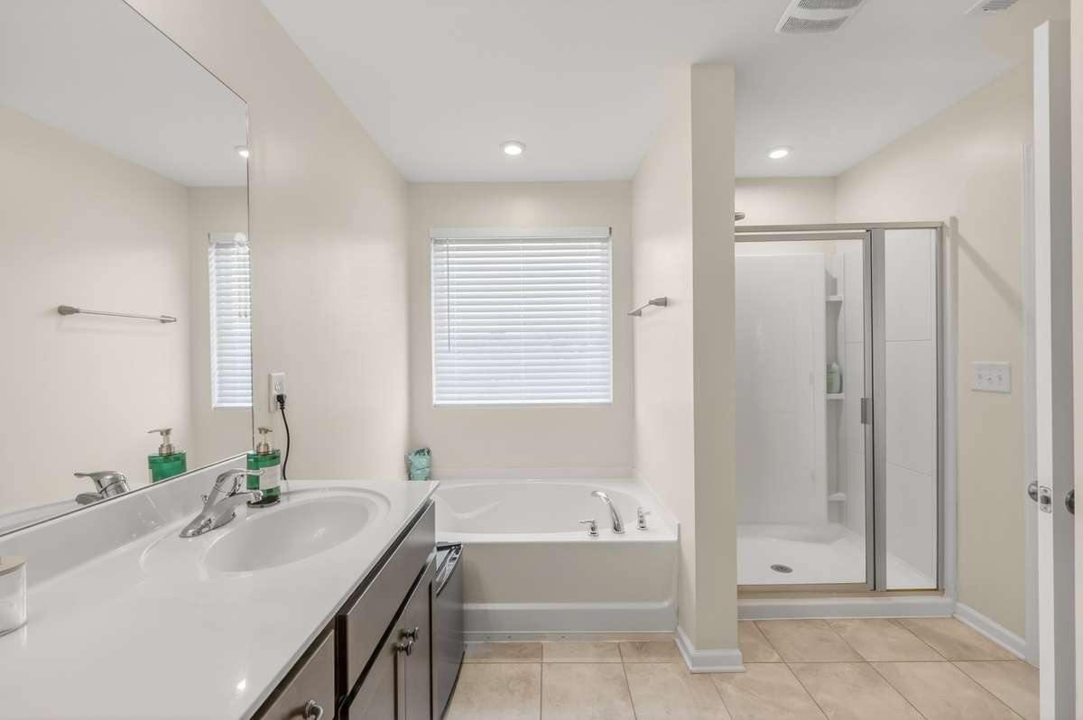 Primary Bathroom features separate Tub and Shower, double vanities, and separate water closet.