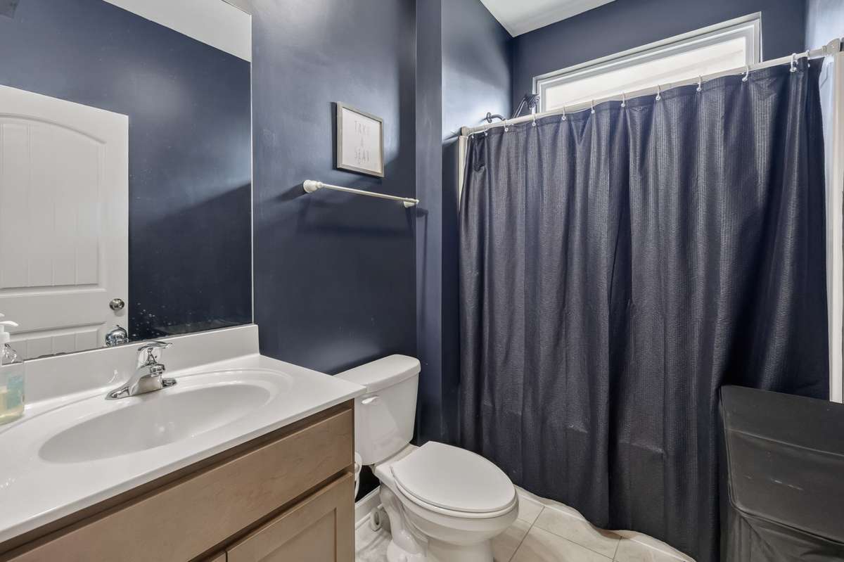Full Bathroom located on main level, conveniently located between 2 bedrooms
