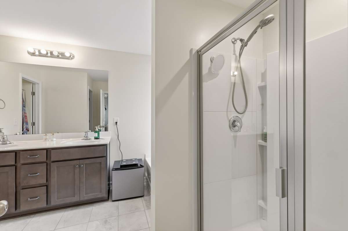 Primary Bathroom features separate Tub and Shower, double vanities, and separate water closet.