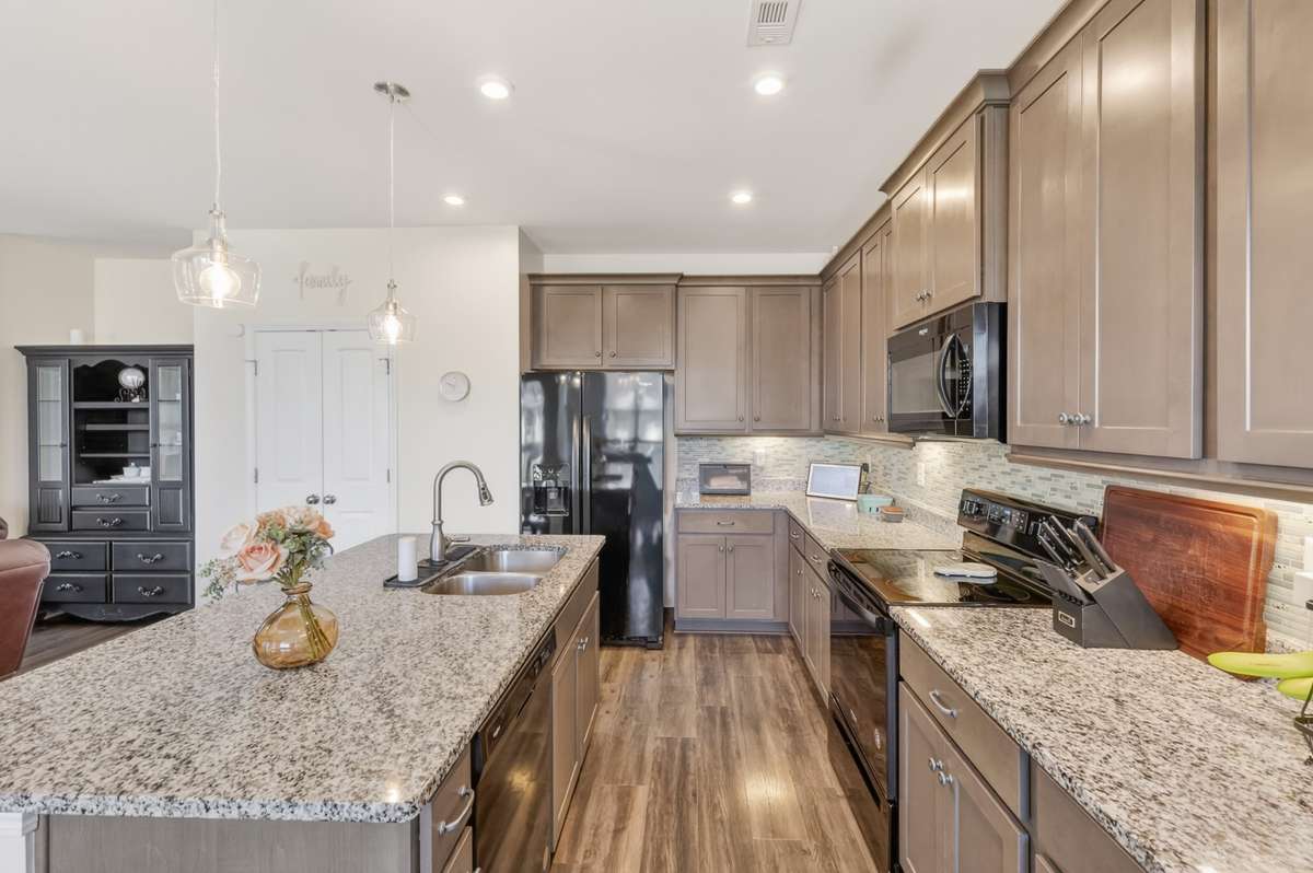 Modern kitchen with granite counter tops and island