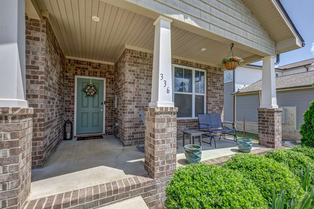 Covered front porch is perfect for sipping coffee in the morning!