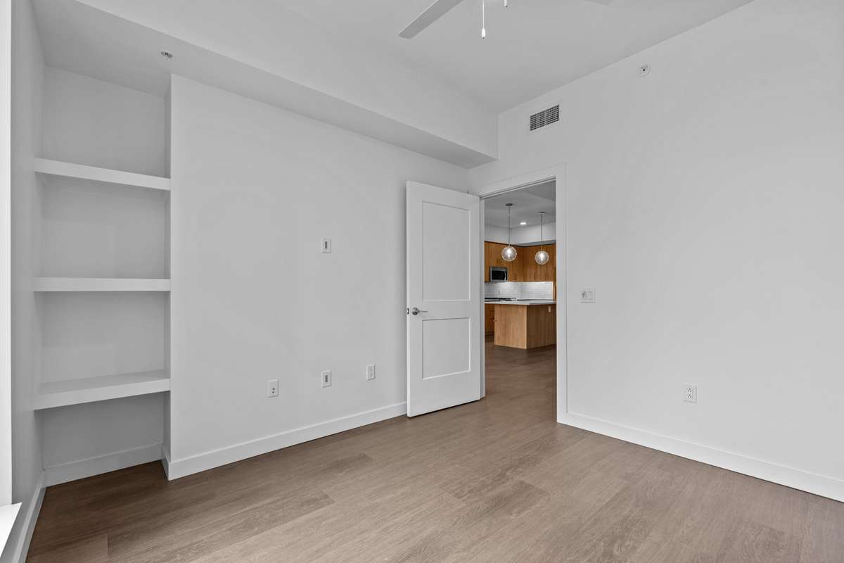 Built-in bedroom shelving offers a smart, space-saving solution—keeping the room open and uncluttered while reducing the need for additional furniture.