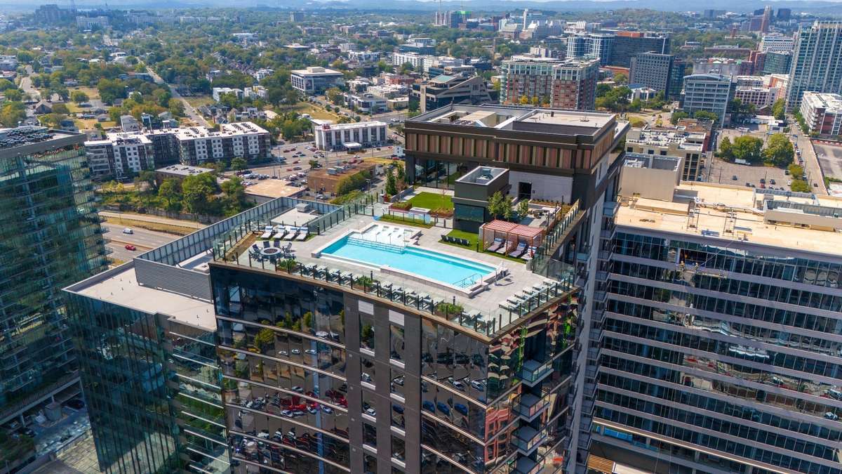 Live steps from the city and come home to a rooftop oasis featuring a stunning pool deck, outdoor lounges, and sweeping skyline views.