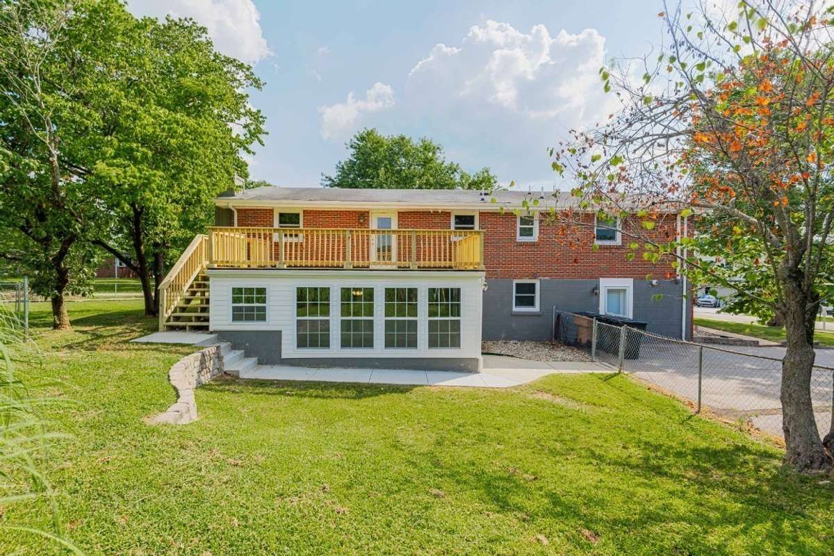 New deck and sunroom upgrades a year ago. Notice the fenced yard.