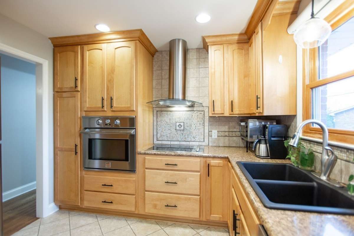Beautiful spacious kitchen with a ton of cabinet space, two refrigerators, and large pantry space