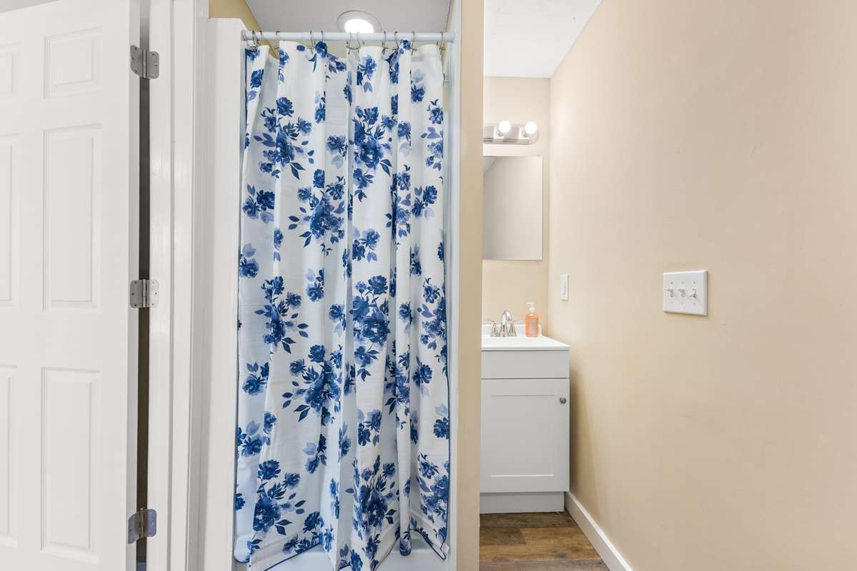 Full bath off the addition's primary bedroom.