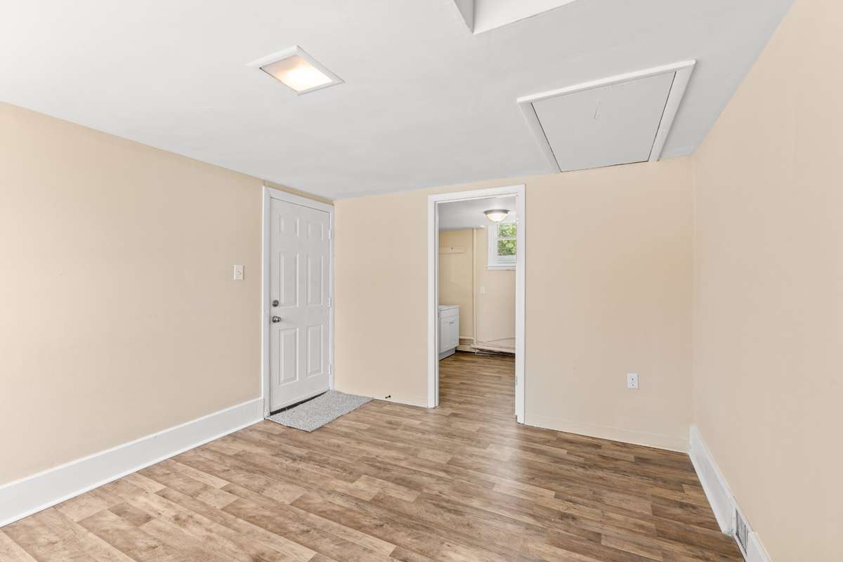 This converted garage also has a utility room. There is a pull down attic with storage space.