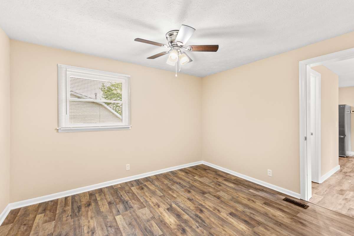 Bedroom 2. The bedrooms have new fans.