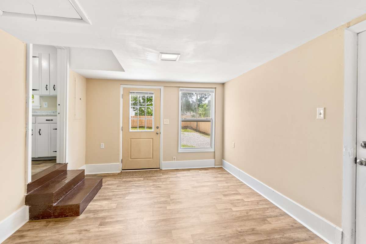 Just off the kitchen is a converted garage space. Room for a home office, home gym, hobby room - you choose!