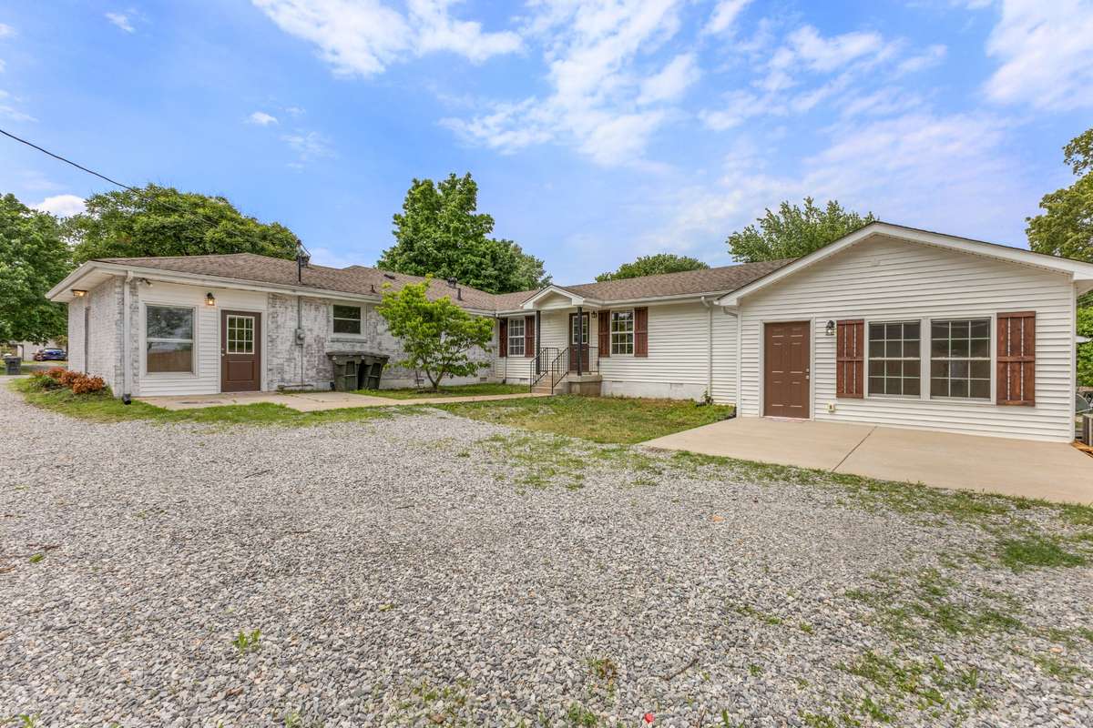 Versatile Springfield property offering true multi-generational living with a fully equipped in-law suite in the rear. View from back of driveway.