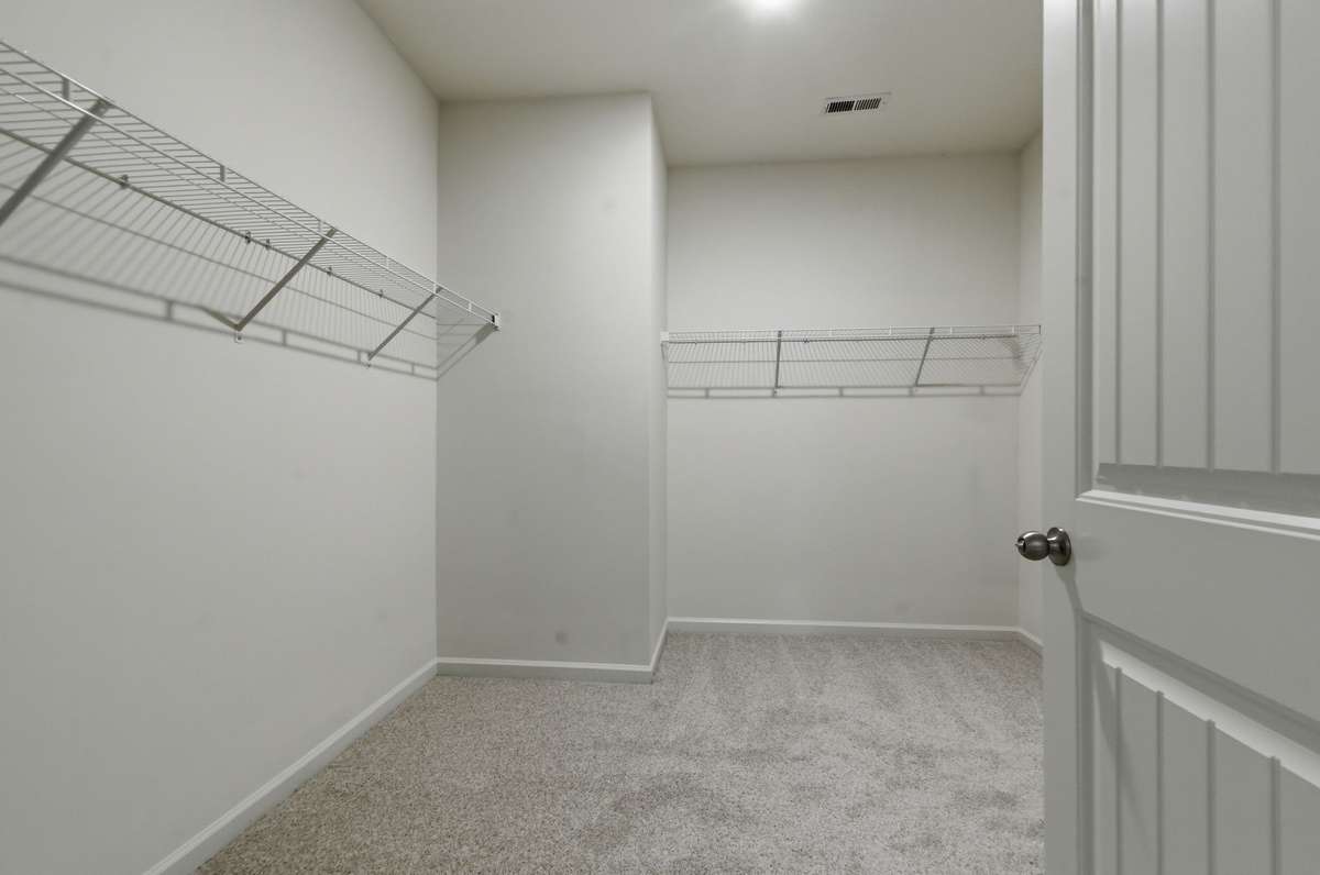 Extra large walk-in closet accessed through primary bath.