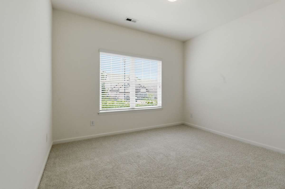 Bedroom #2--new carpet and large window.