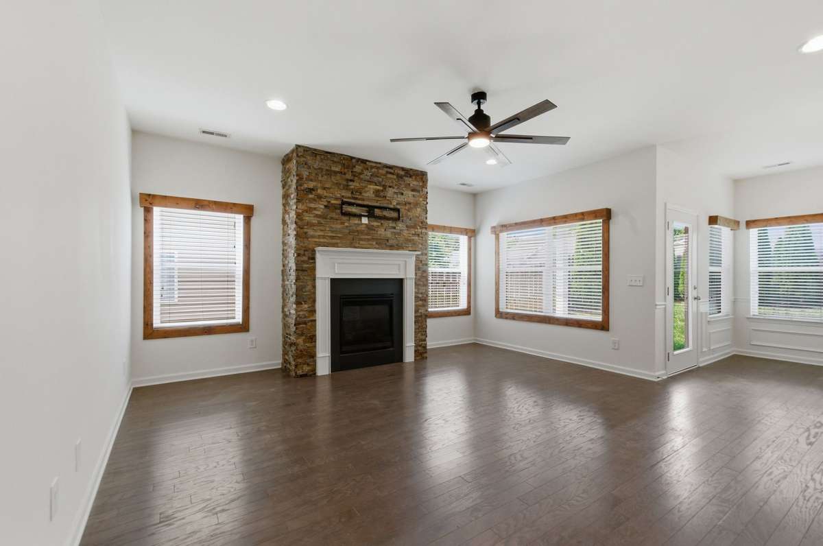 Gas fireplace in great room with beautiful stacked stone surround.