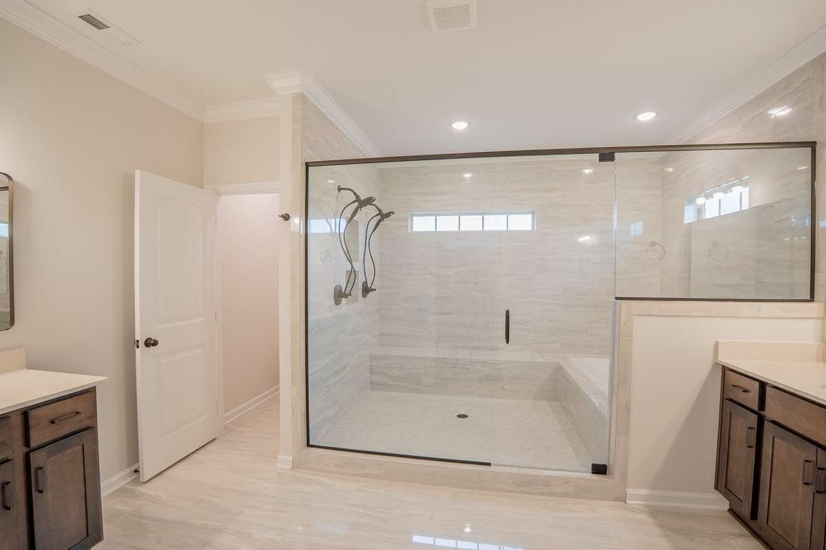 EXAMPLE >>>Primary Bathroom with a Luxurious Walk-in Tile Shower with 2 Shower Heads and a Soaker Tub, All Enclosed Behind Glass!