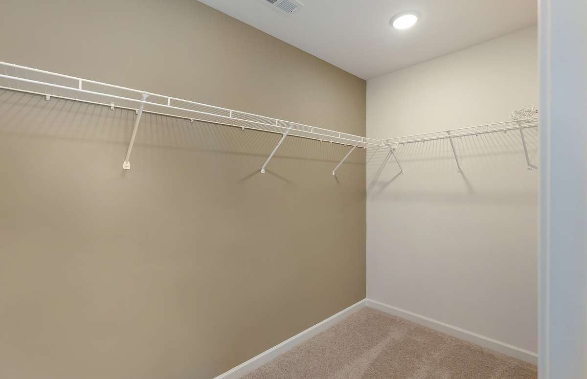 ***Photo is from a brand new Rosella Model home*** The Owner's Suite also includes a large walk in closet.