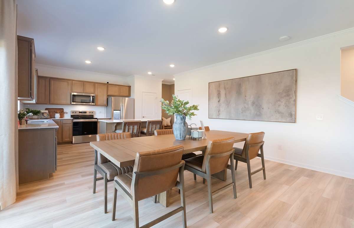 ***Photo is from a brand new Rosella Model home*** Located off the Kitchen is the Dining Room, which is designed to comfortably fit a 6 to 8 person table.
