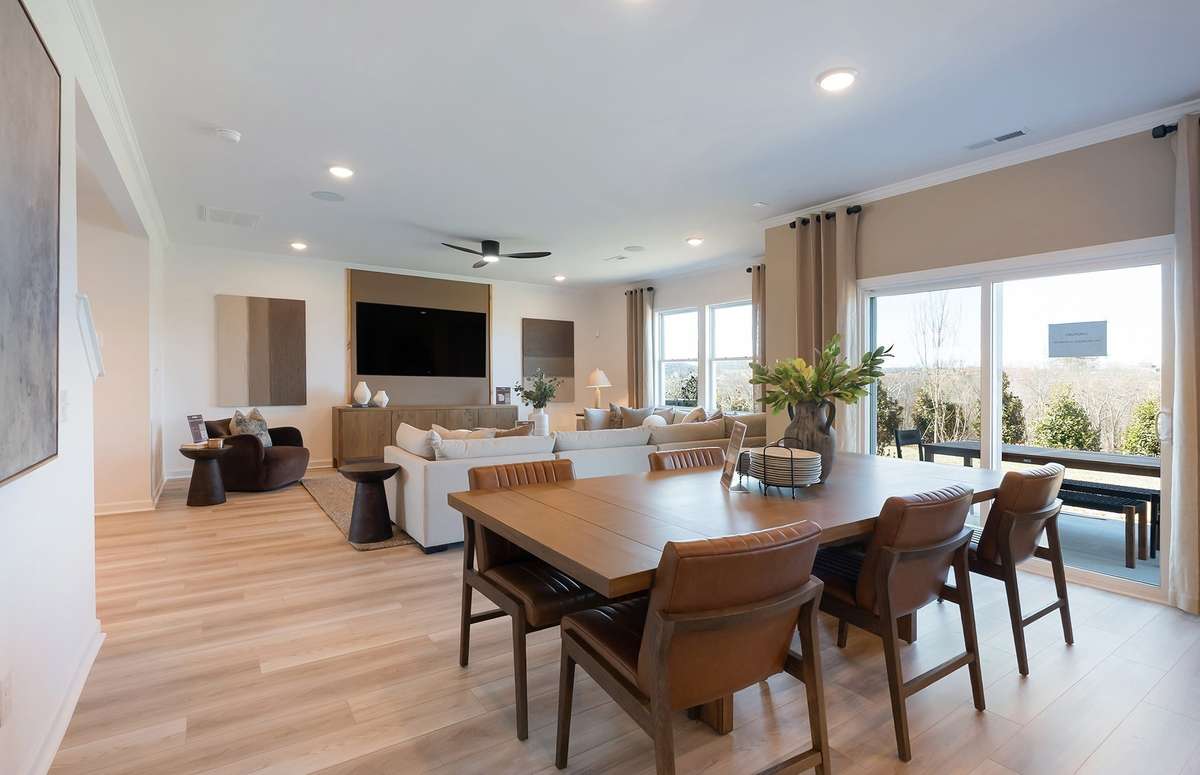 ***Photo is from a brand new Rosella Model home*** Located right off the Kitchen and Dining spaces off the rear of the home will be a covered patio. This is the perfect space to relax and enjoy your morning coffee.