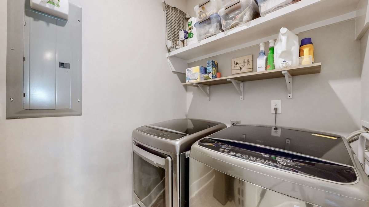 Utility Room located off Kitchen, top loading washer & dryer convey