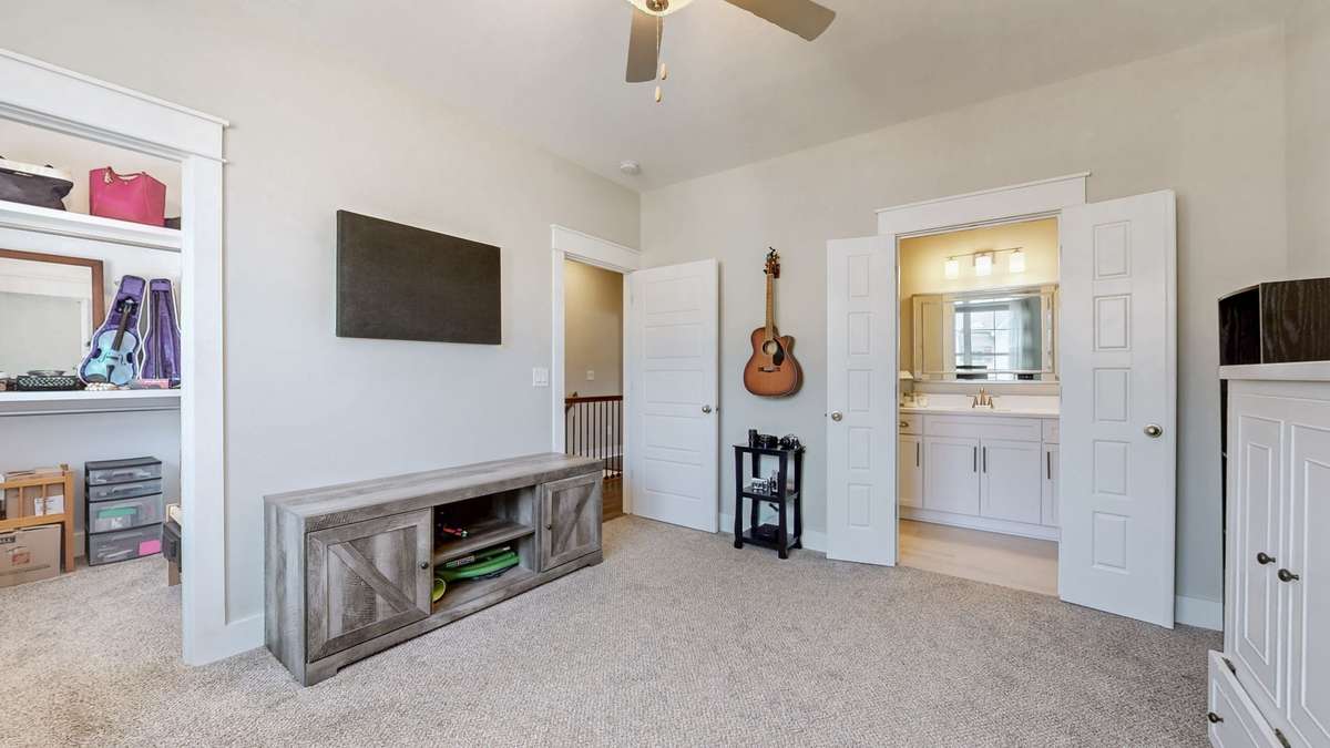 2 of 2 Primary Suite with walk-in closet and ensuite bath. Easy mount TV wall with plugs and Cat5 access
