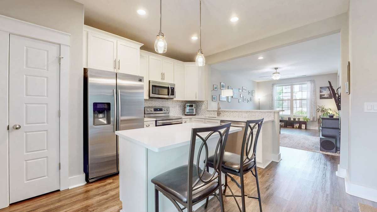 Kitchen featuring 2 island and peninsula for optimized seating and entertaining.