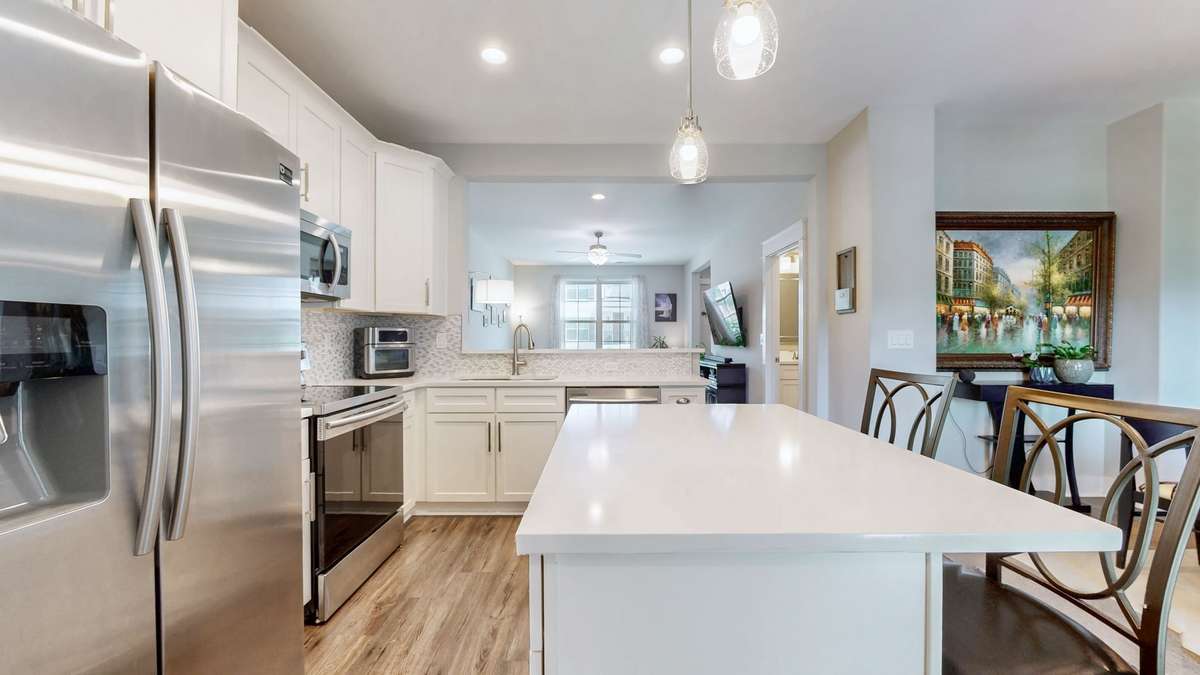 Kitchen featuring 2 island and peninsula for optimized seating and entertaining.