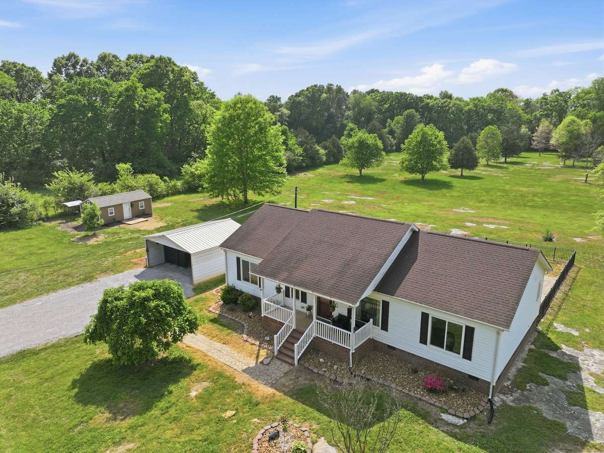 Home, Carport, She-Shed and more... on 5 level acres!