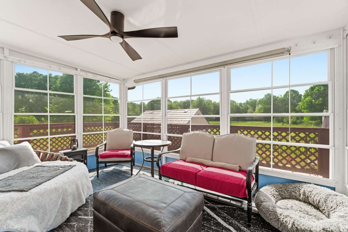 Fantastic Sunroom addition with tons of natural light, ceiling fan and a mini-split HVAC unit!