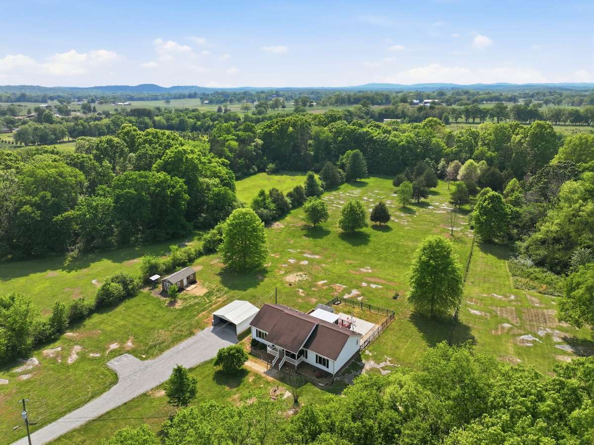 FIVE level acres w/ privacy and room for more!