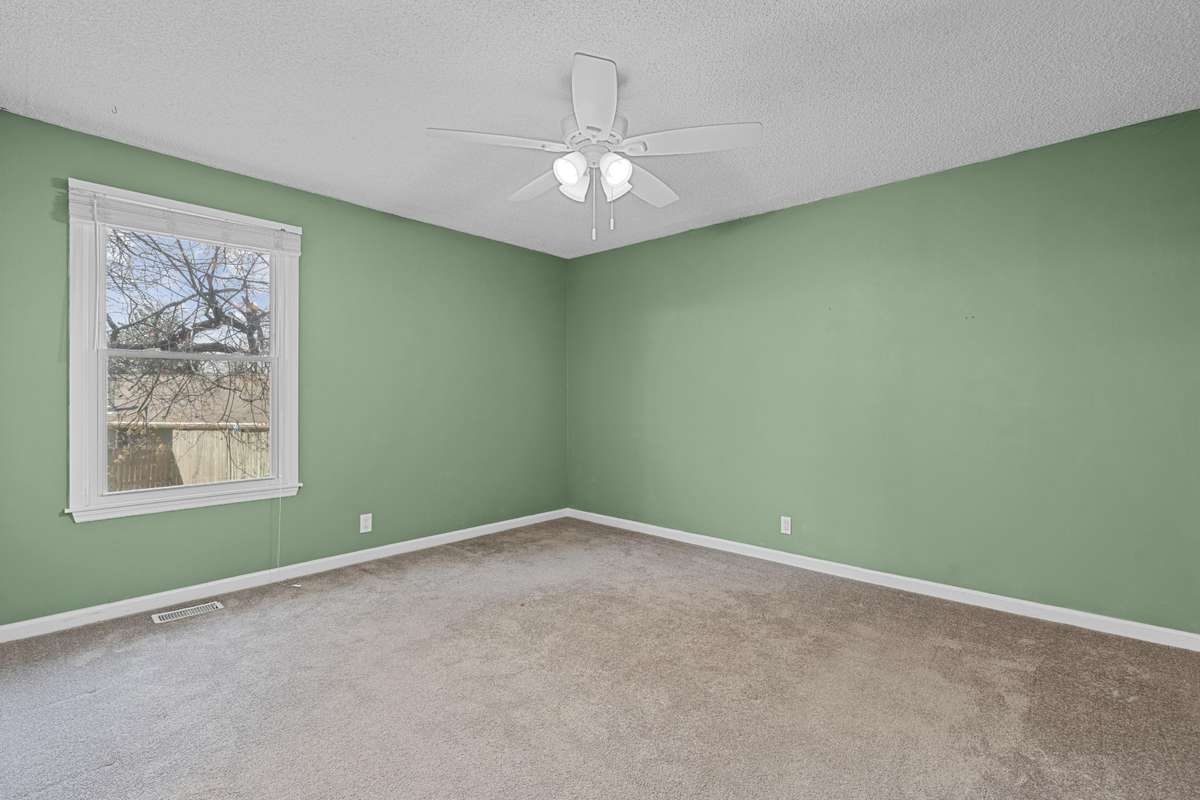 Primary Bedroom With Ceiling Fan