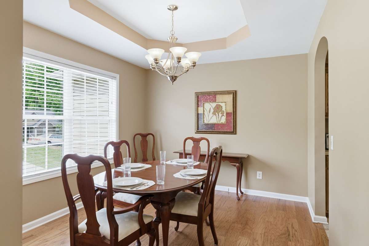 The formal living room is filled with light