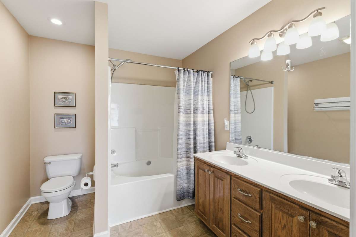 The ensuite bathroom has twin vanities