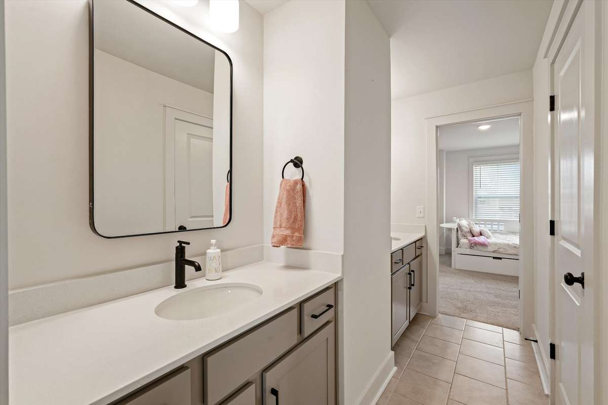bedroom 2 and 3 share a jack and jill bathroom with their own sinks